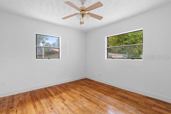 1404 East Alfred Street Tavares, FL 32778 - Photo 25 of 38 a view of a room with wooden floor and a window