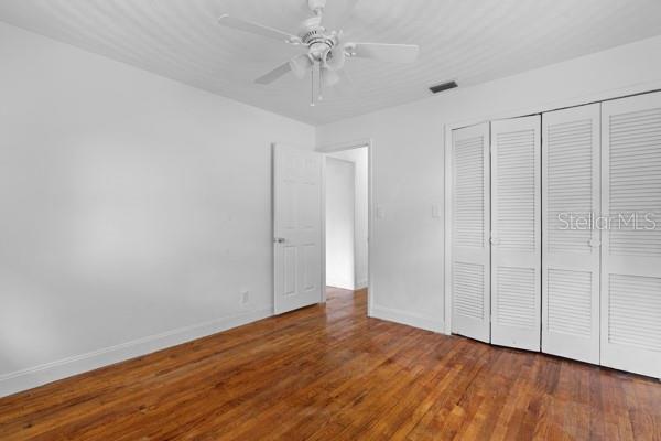 1404 East Alfred Street Tavares, FL 32778 - Photo 26 of 38 a view of an empty room with wooden floor