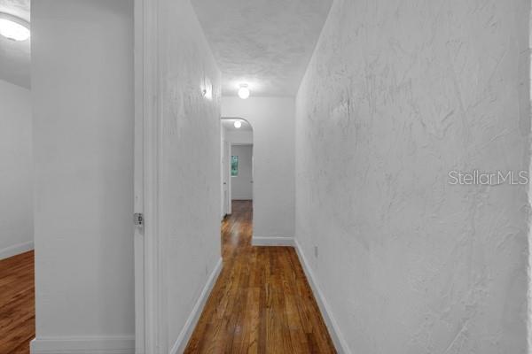 1404 East Alfred Street Tavares, FL 32778 - Photo 35 of 38 a view of a hallway with wooden floor