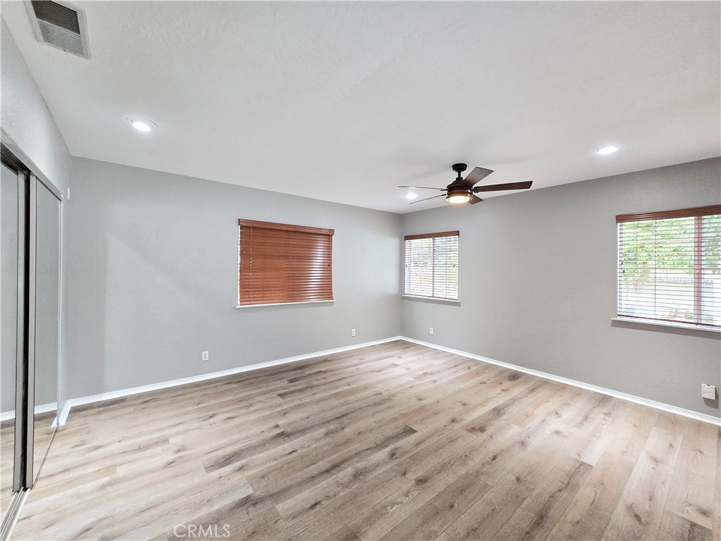 4651 Emerson Street Riverside, CA 92506 - Photo 15 of 32 a view of an empty room with wooden floor and a window