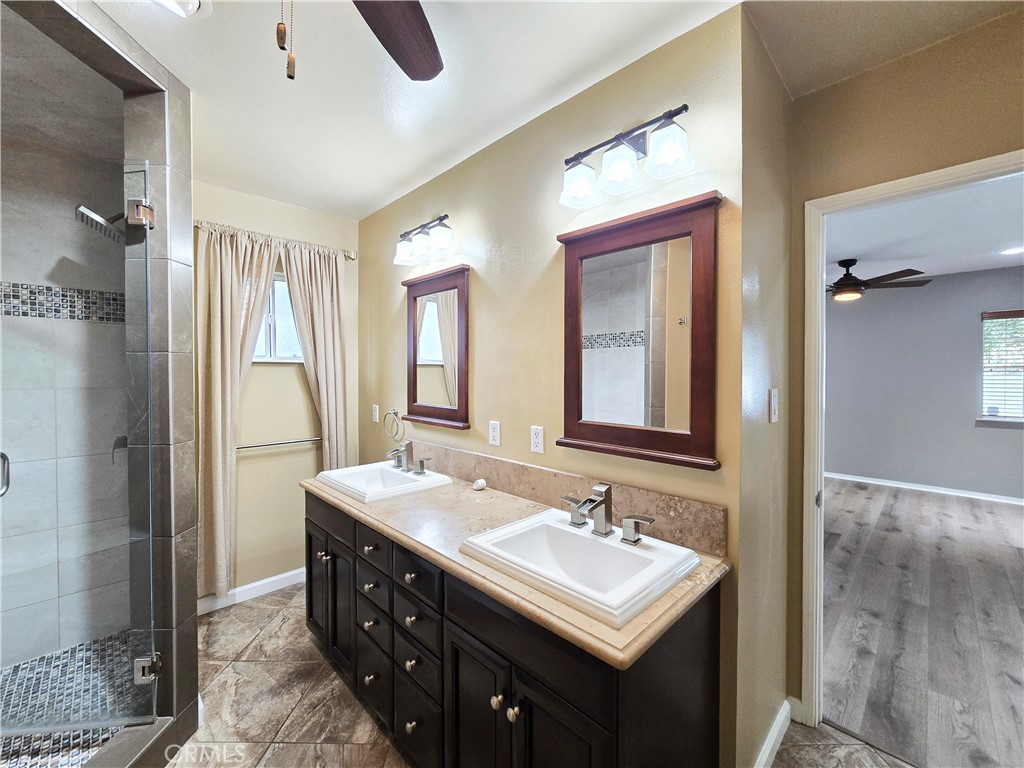 4651 Emerson Street Riverside, CA 92506 - Photo 18 of 32 a bathroom with a sink double vanity and a mirror
