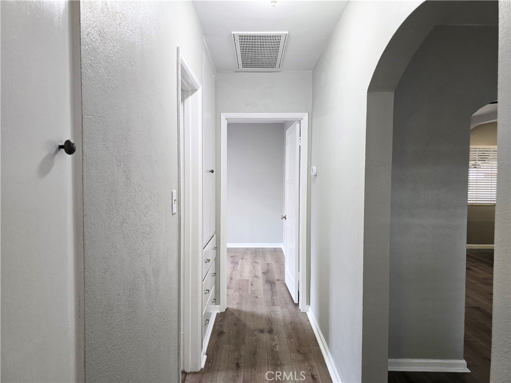 4651 Emerson Street Riverside, CA 92506 - Photo 20 of 32 a view of a hallway with wooden floor