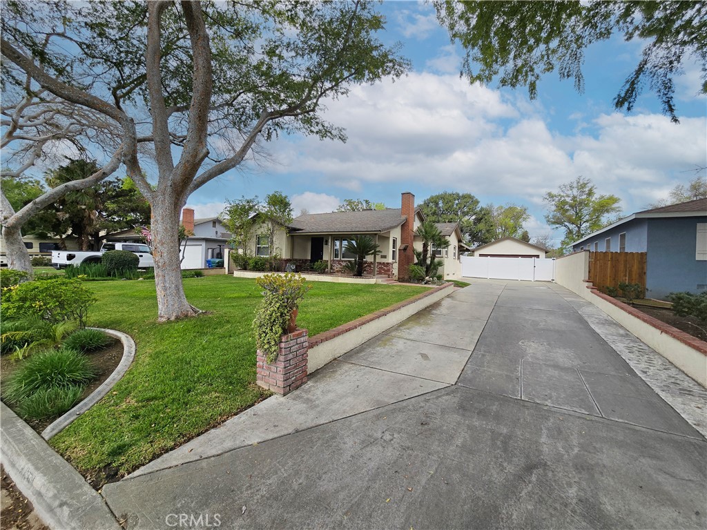 4651 Emerson Street Riverside, CA 92506 - Photo 2 of 32 a view of a house with a yard