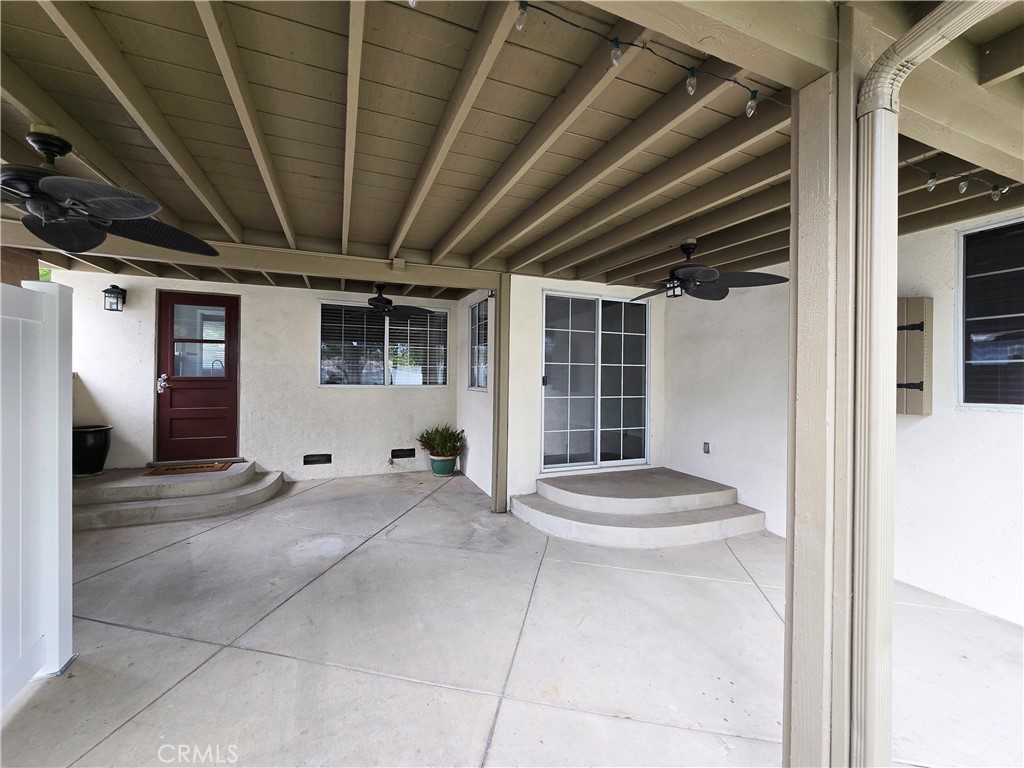 4651 Emerson Street Riverside, CA 92506 - Photo 26 of 32 a view of a hallway with chair and front door
