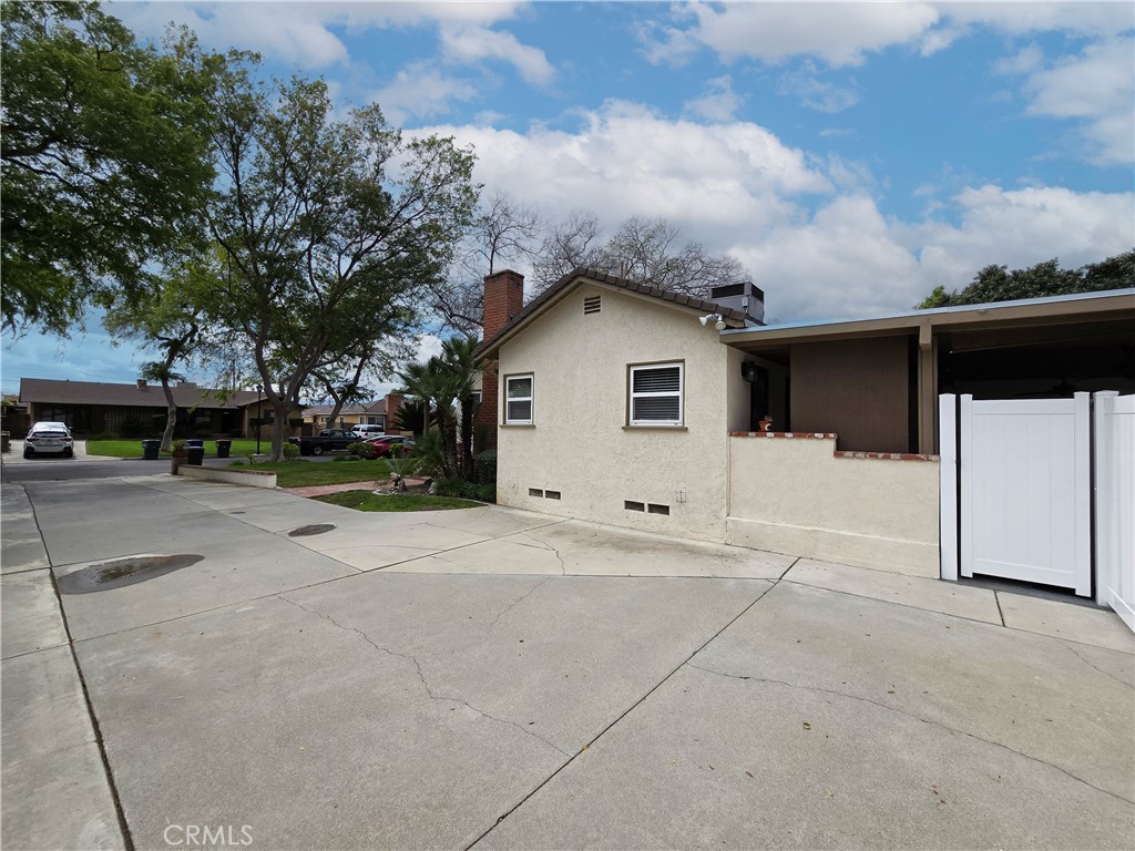 4651 Emerson Street Riverside, CA 92506 - Photo 32 of 32 a view of a house with a yard and large tree