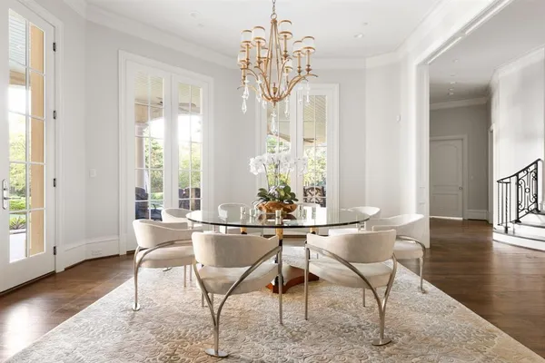 a living room with furniture and large windows