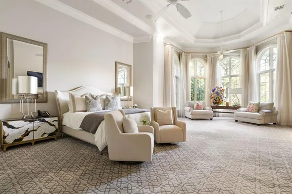 a living room with furniture large window and a flat screen tv