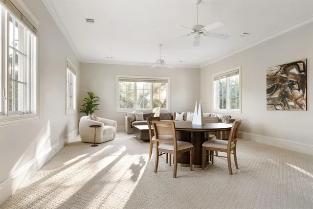 a view of a building with a porch and furniture