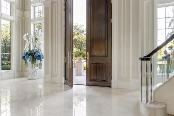a view of an entryway with wooden floor and door