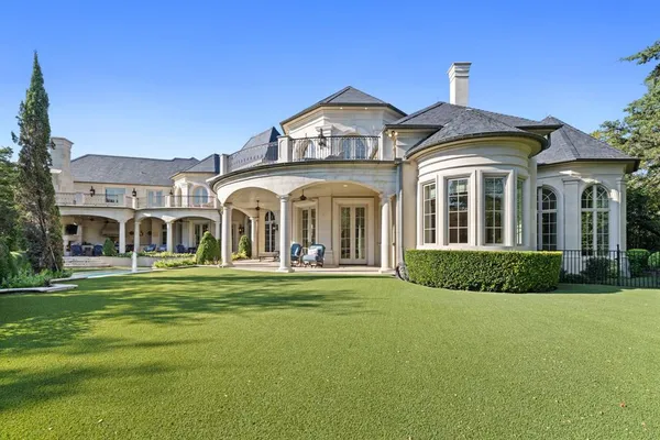 a front view of a house with a swimming pool