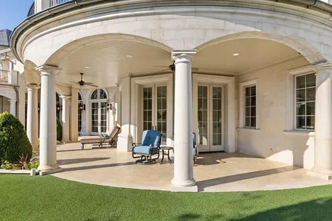 front view of a building with a garden