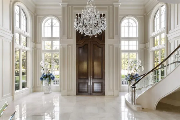 a view of entryway and hall with a front door