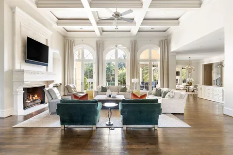 a living room with furniture fireplace and flat screen tv
