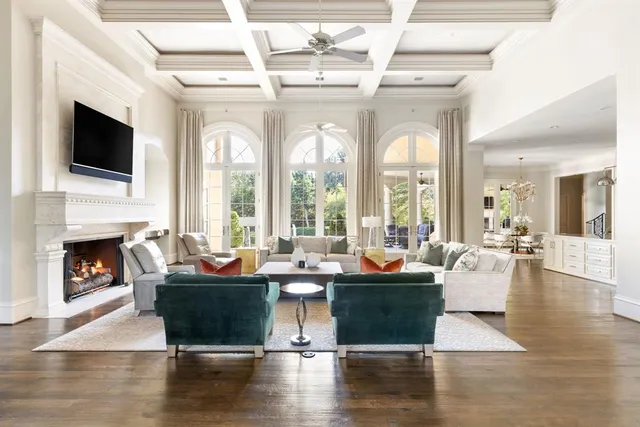 a living room with furniture fireplace and flat screen tv