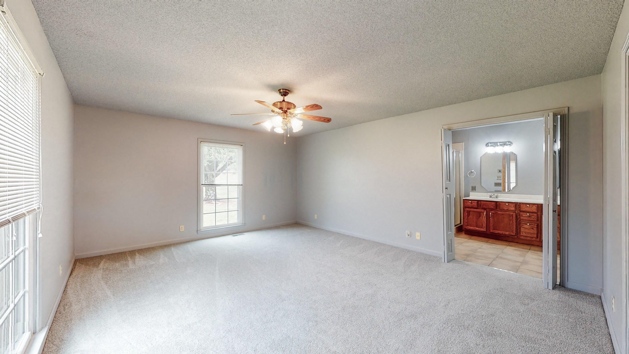 35 Palmer Road Lebanon, TN 37087 - Photo 14 of 23 an empty room with chandelier fan and windows