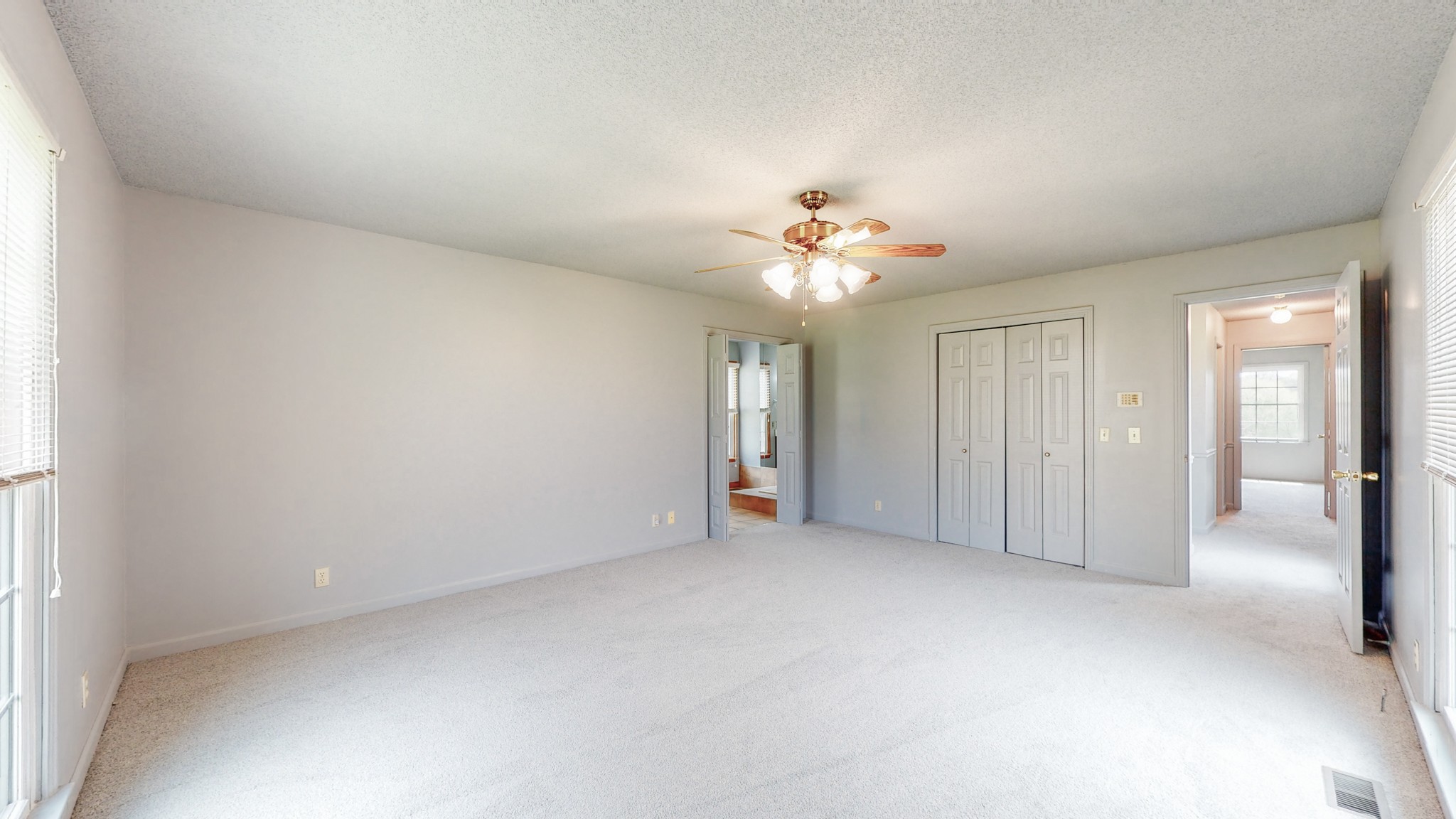 35 Palmer Road Lebanon, TN 37087 - Photo 15 of 23 an empty room with chandelier fan and windows
