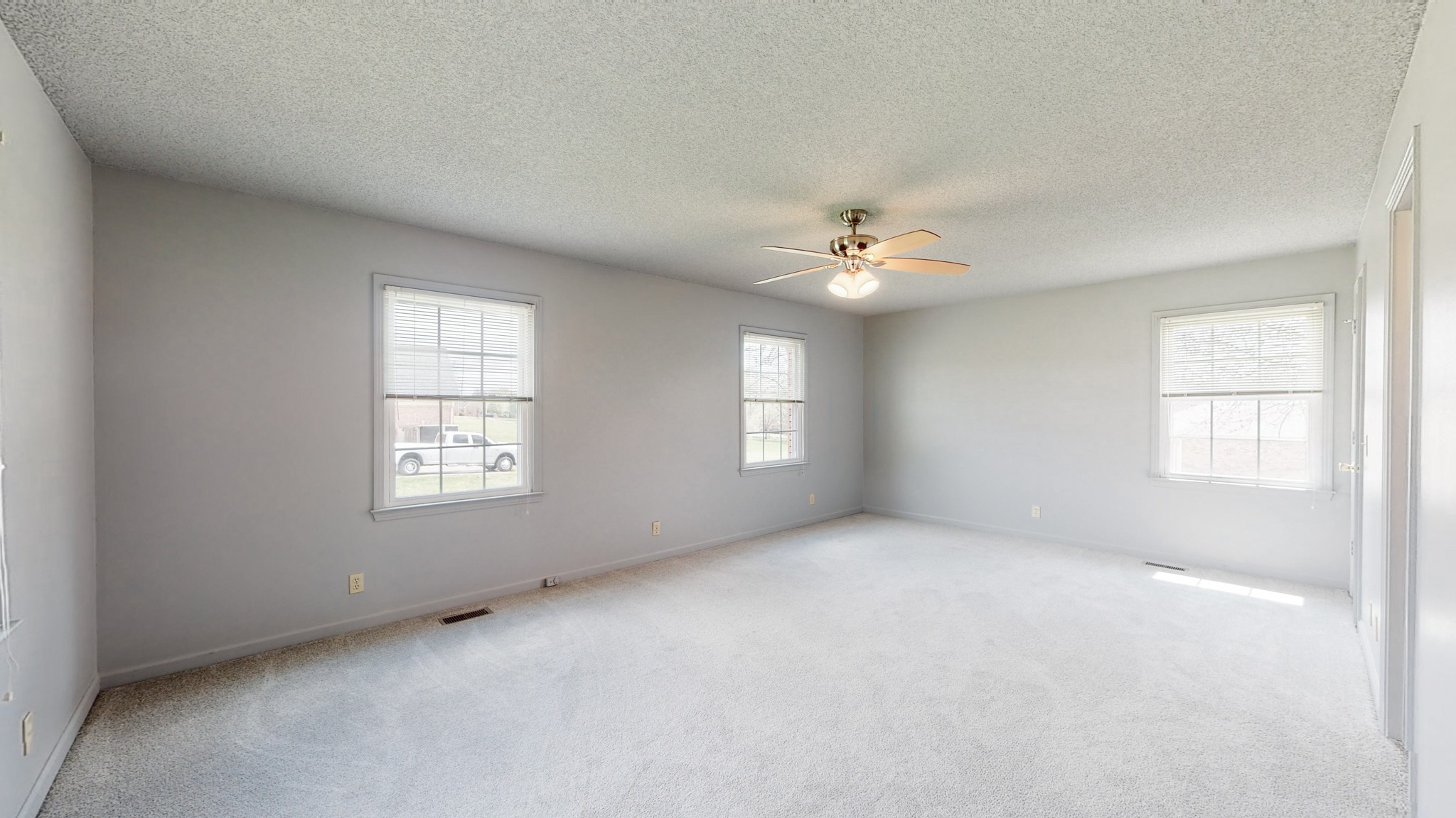 35 Palmer Road Lebanon, TN 37087 - Photo 17 of 23 an empty room with windows and chandelier fan
