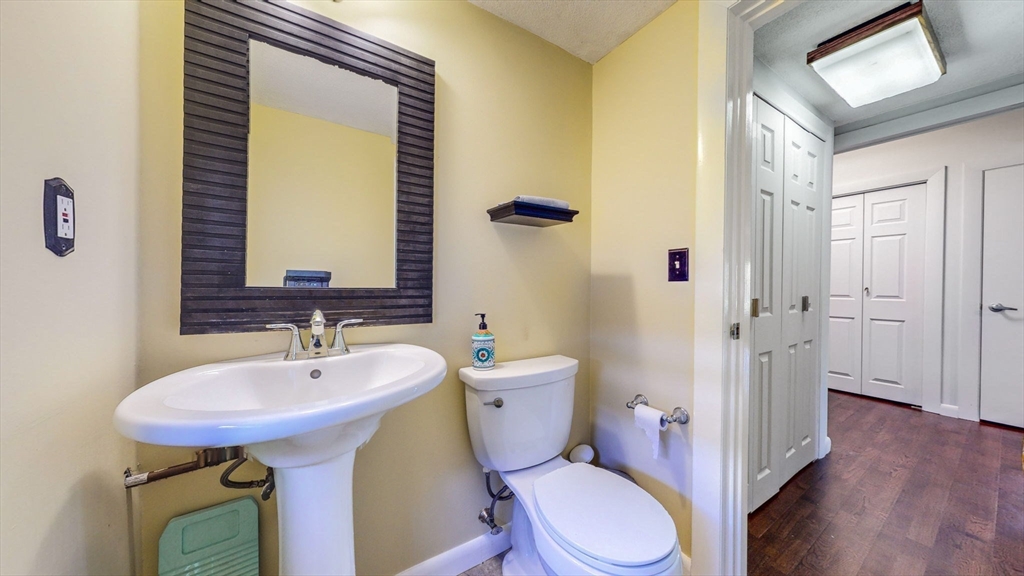15 Carlin Road Waltham, MA 02451 - Photo 15 of 42 a bathroom with a sink toilet and shower