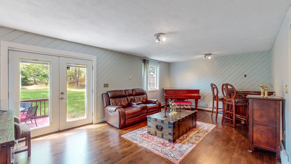 15 Carlin Road Waltham, MA 02451 - Photo 17 of 42 a living room with furniture and a wooden floor