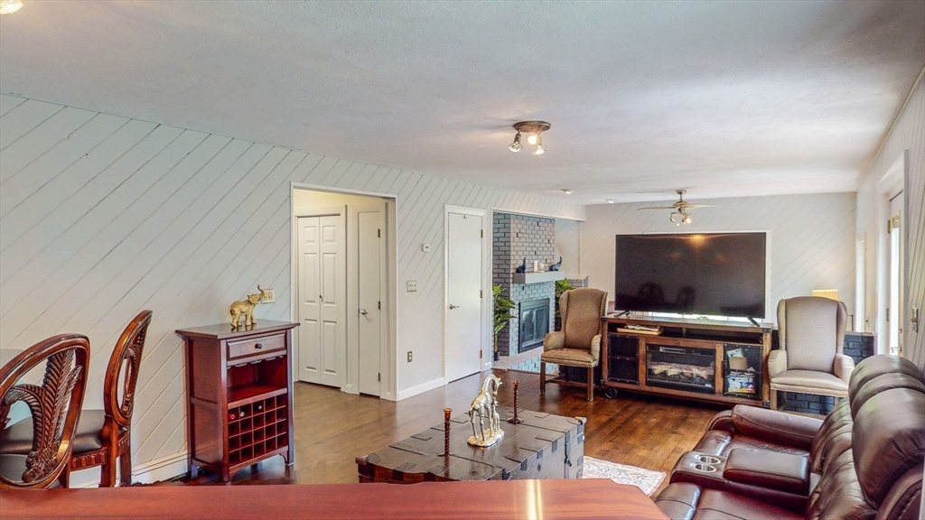 15 Carlin Road Waltham, MA 02451 - Photo 18 of 42 a living room with furniture and a flat screen tv