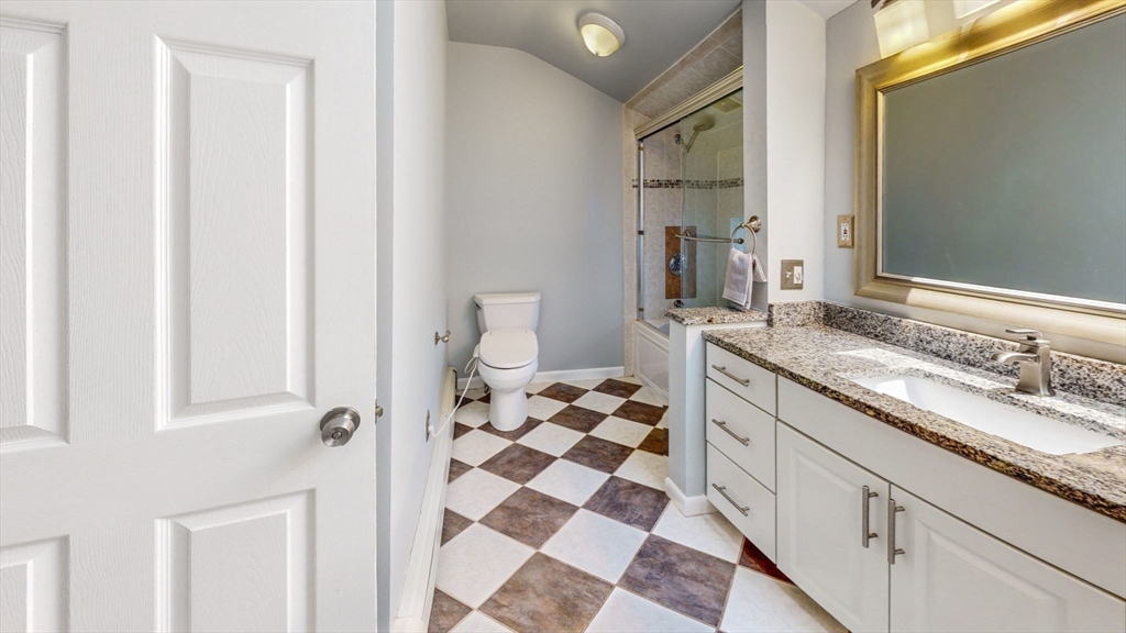 15 Carlin Road Waltham, MA 02451 - Photo 32 of 42 a bathroom with a sink and a mirror