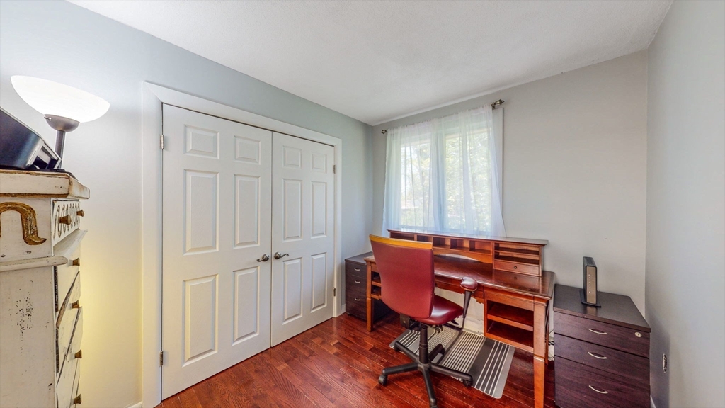 15 Carlin Road Waltham, MA 02451 - Photo 34 of 42 a view of a room with lounge chair and wooden floor