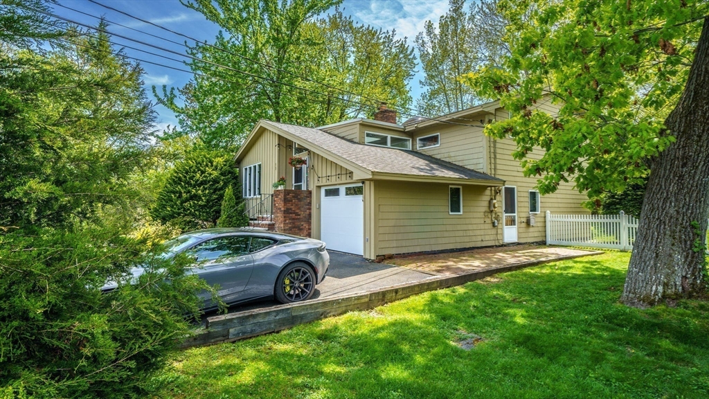 15 Carlin Road Waltham, MA 02451 - Photo 39 of 42 a front view of a house with garden