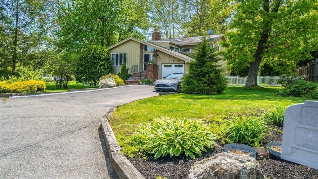 15 Carlin Road Waltham, MA 02451 - Photo 41 of 42 a view of a house with a big yard plants and large trees