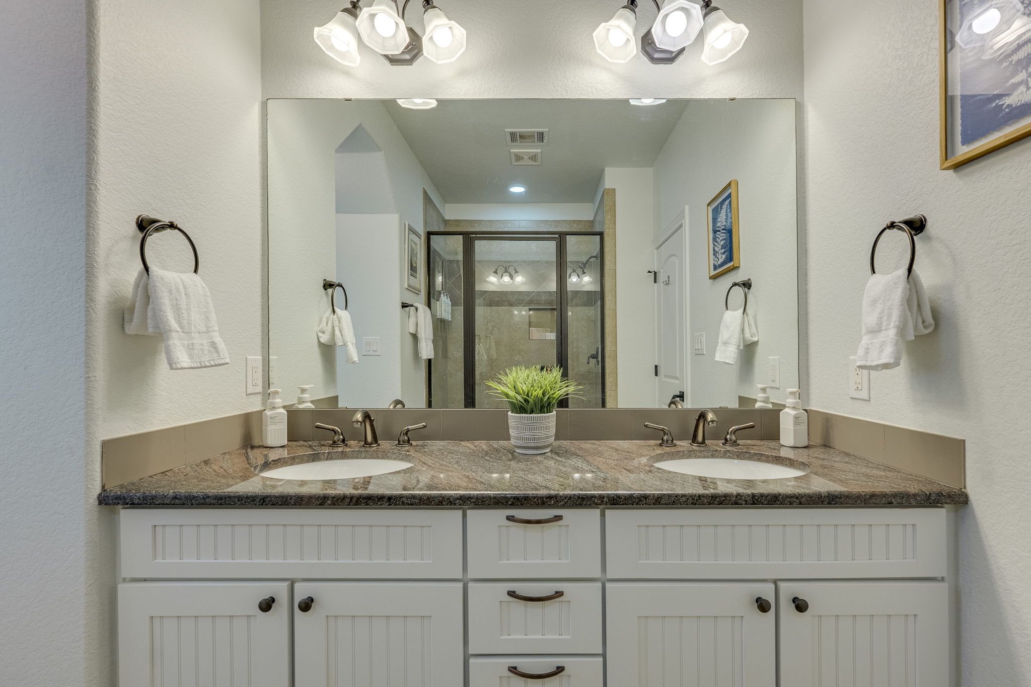 433 Venture Boulevard South Point Venture, TX 78645 - Photo 18 of 36 The primary's ensuite has a dual
granite vanity.