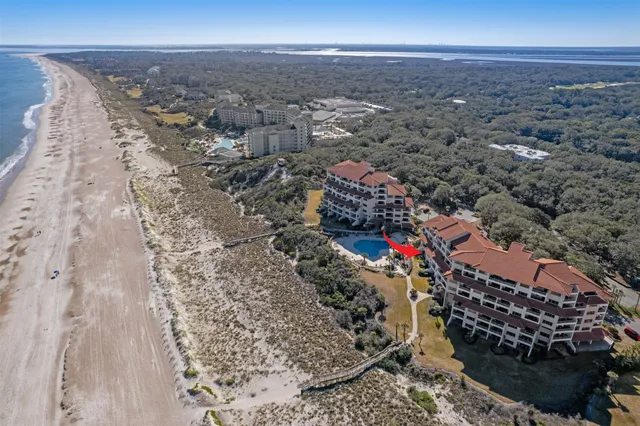 a sign that is sitting on a wooden fence
