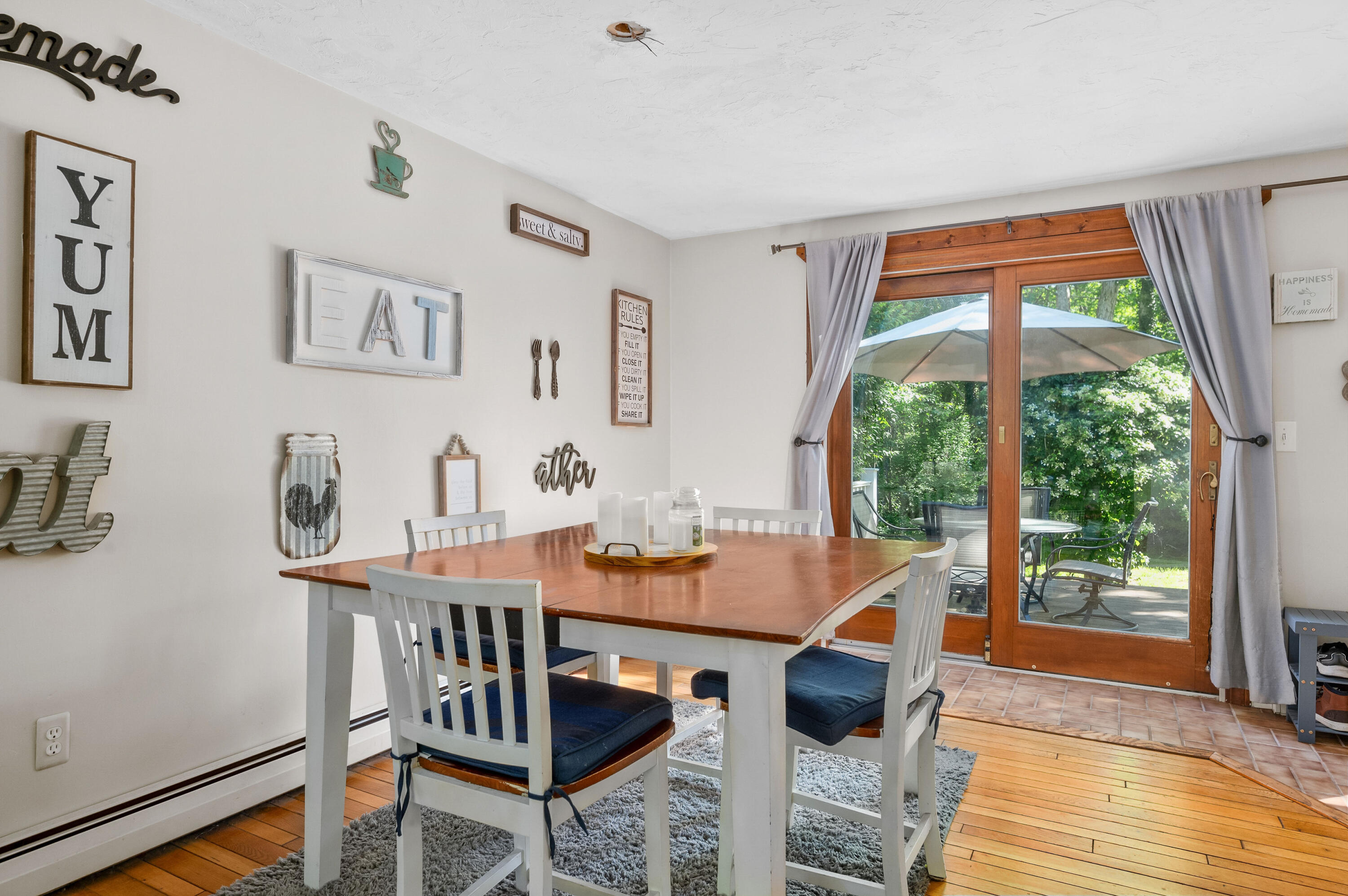 292 Jones Road Marstons Mills, MA 02648 - Photo 15 of 38 a view of a dining room with furniture and wooden floor