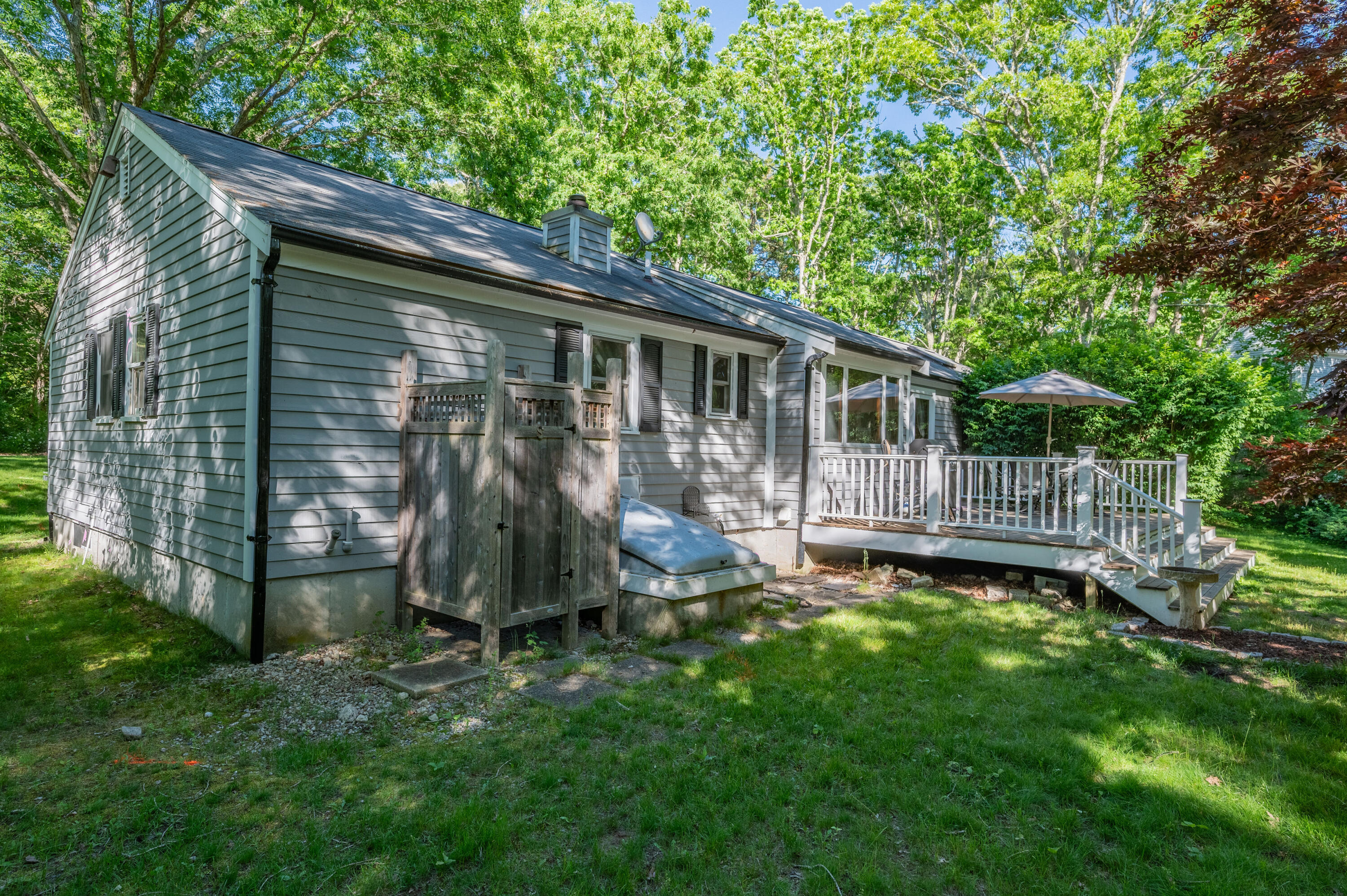 292 Jones Road Marstons Mills, MA 02648 - Photo 28 of 38 a view of a small house with backyard