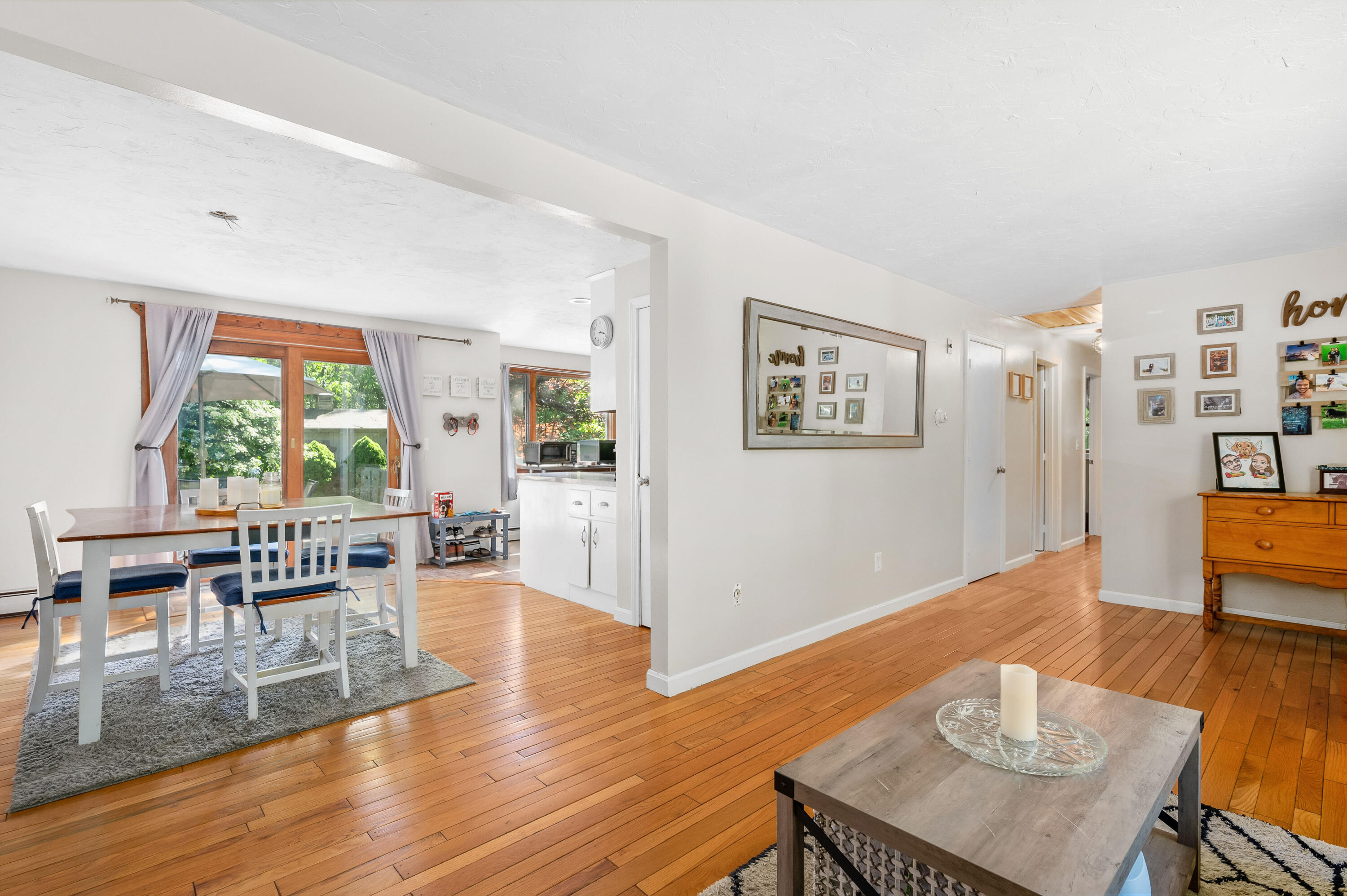 292 Jones Road Marstons Mills, MA 02648 - Photo 10 of 38 a living room with furniture dining table and wooden floor