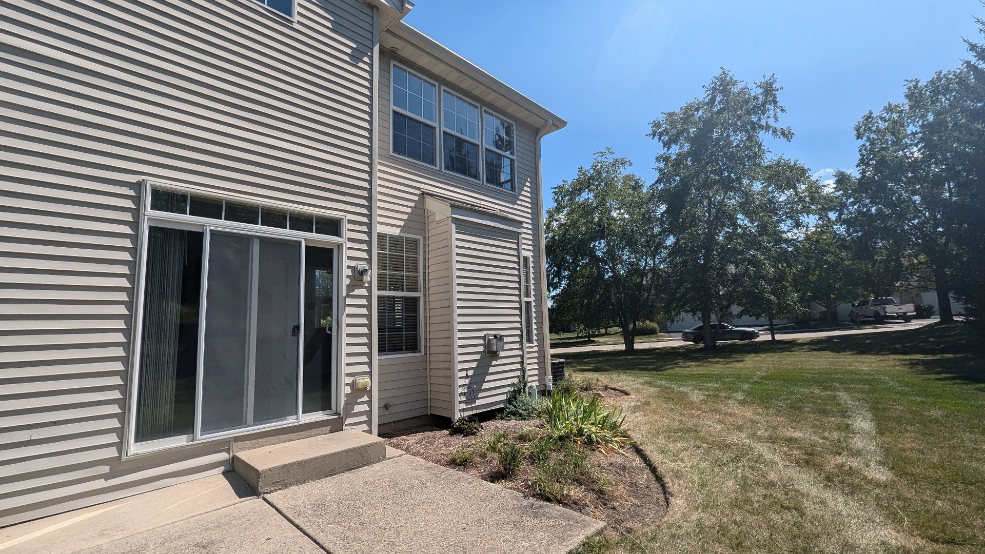 2075 Village View Drive Yorkville, IL 60560 - Photo 15 of 15 a view of a backyard with a large tree