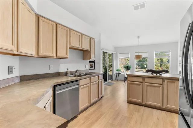 a dining room with furniture window and wooden floor