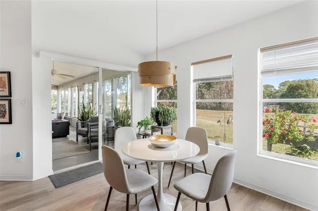 a bedroom with a bed and a large mirror