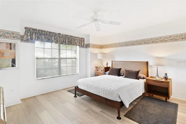 a view of a livingroom with workspace and a window