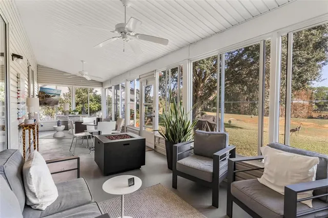 a view of a house with a yard porch and sitting area