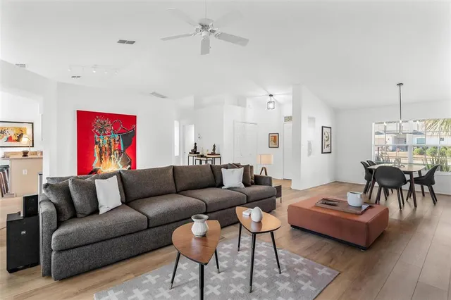 a view of a dining room with furniture window and wooden floor