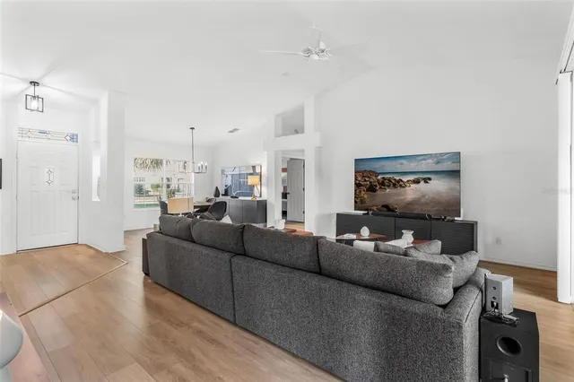 a view of a dining room with furniture window and wooden floor