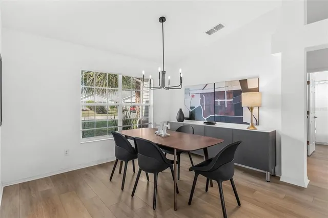 a kitchen with a stove a sink and a refrigerator