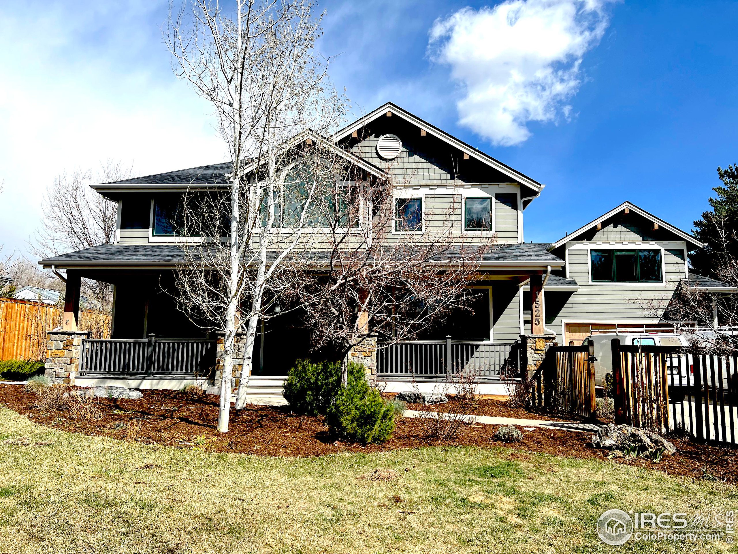 1525 Oak Avenue Boulder, CO 80304 - Photo 1 of 30 a front view of a house with a yard table and chairs