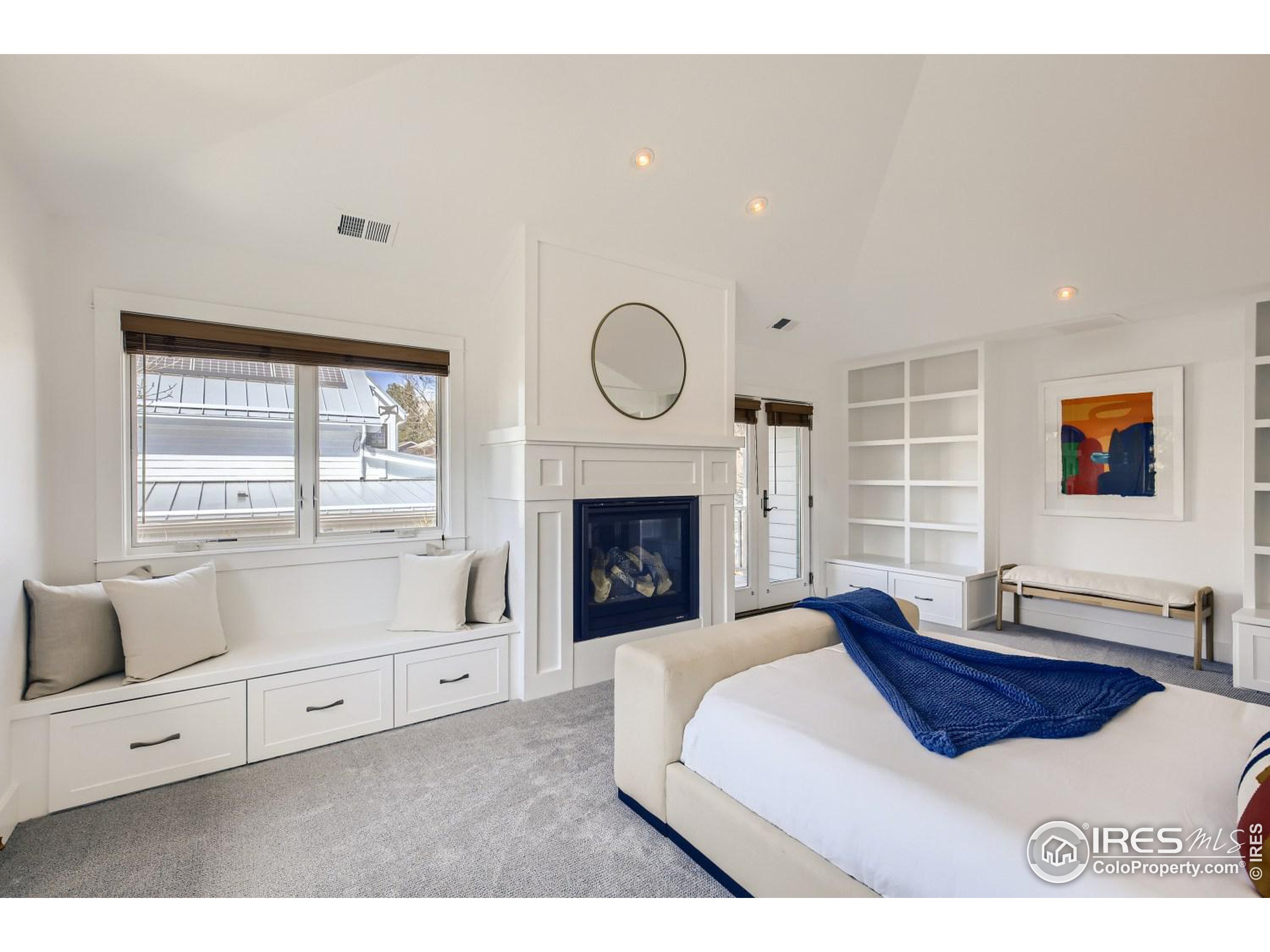 1525 Oak Avenue Boulder, CO 80304 - Photo 20 of 30 a bedroom with a bed and a fireplace