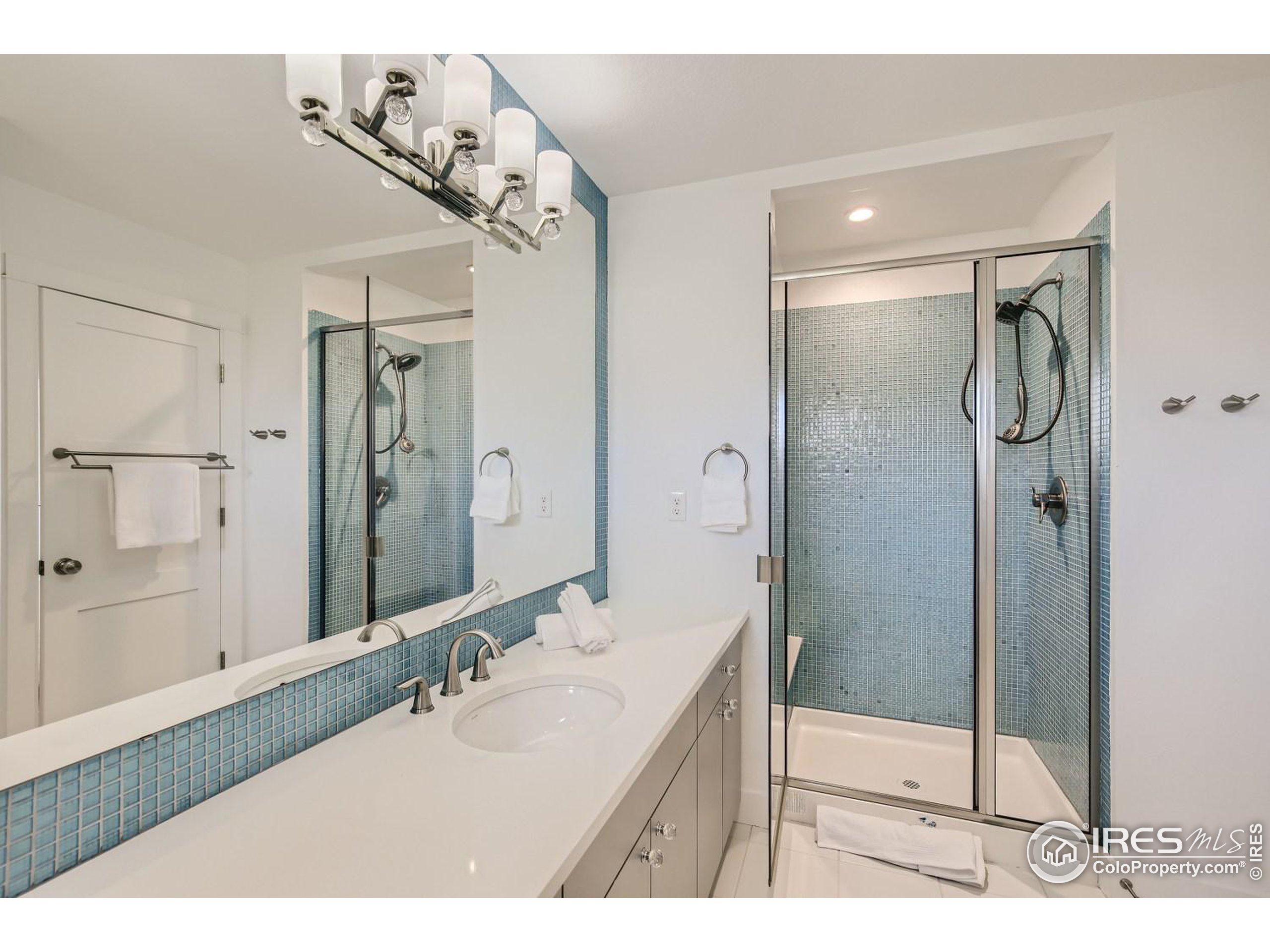 1525 Oak Avenue Boulder, CO 80304 - Photo 23 of 30 a bathroom with a shower sink and mirror