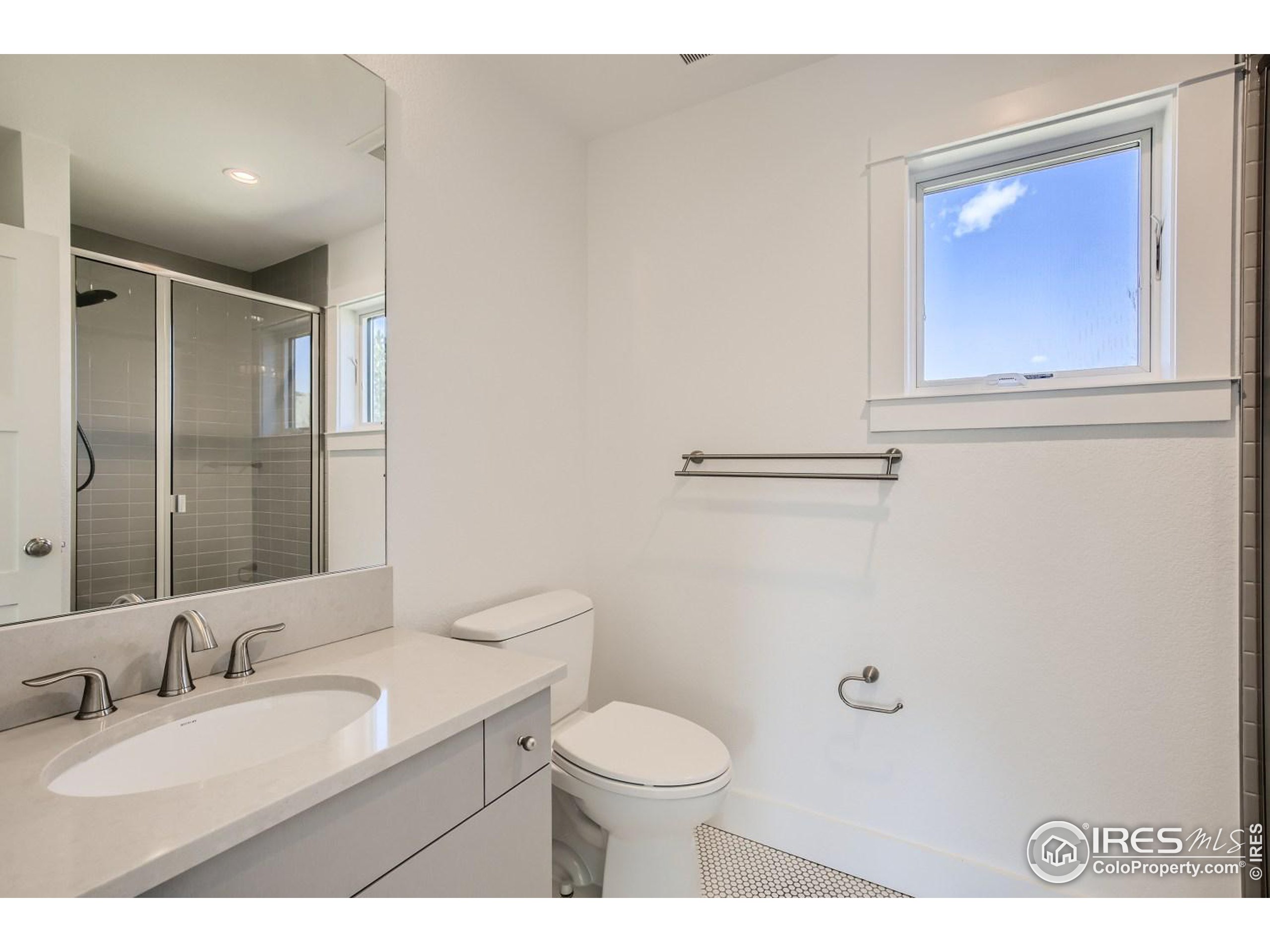 1525 Oak Avenue Boulder, CO 80304 - Photo 26 of 30 a bathroom with a granite countertop toilet sink and mirror