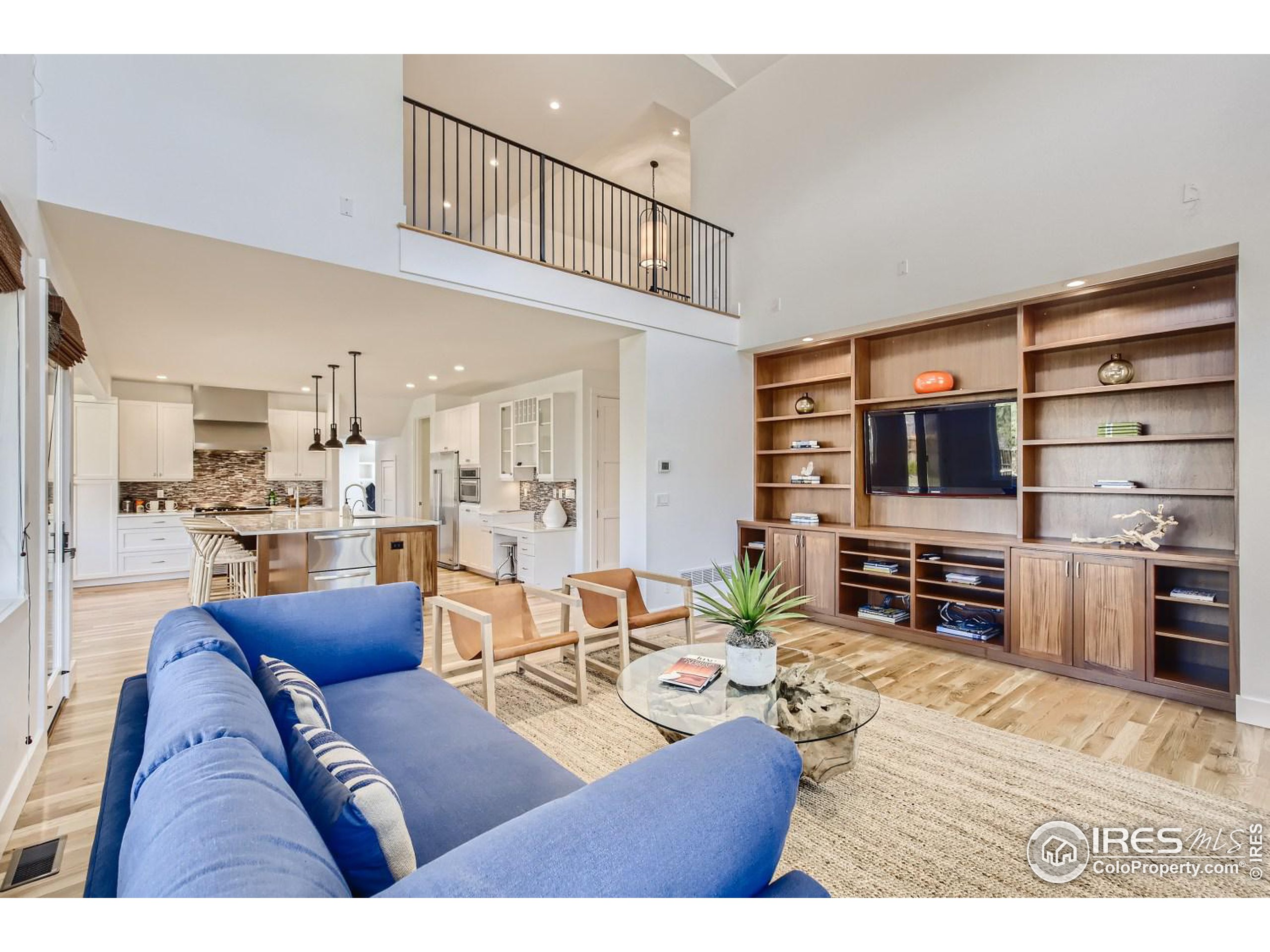 1525 Oak Avenue Boulder, CO 80304 - Photo 4 of 30 a living room with furniture a flat screen tv and kitchen view
