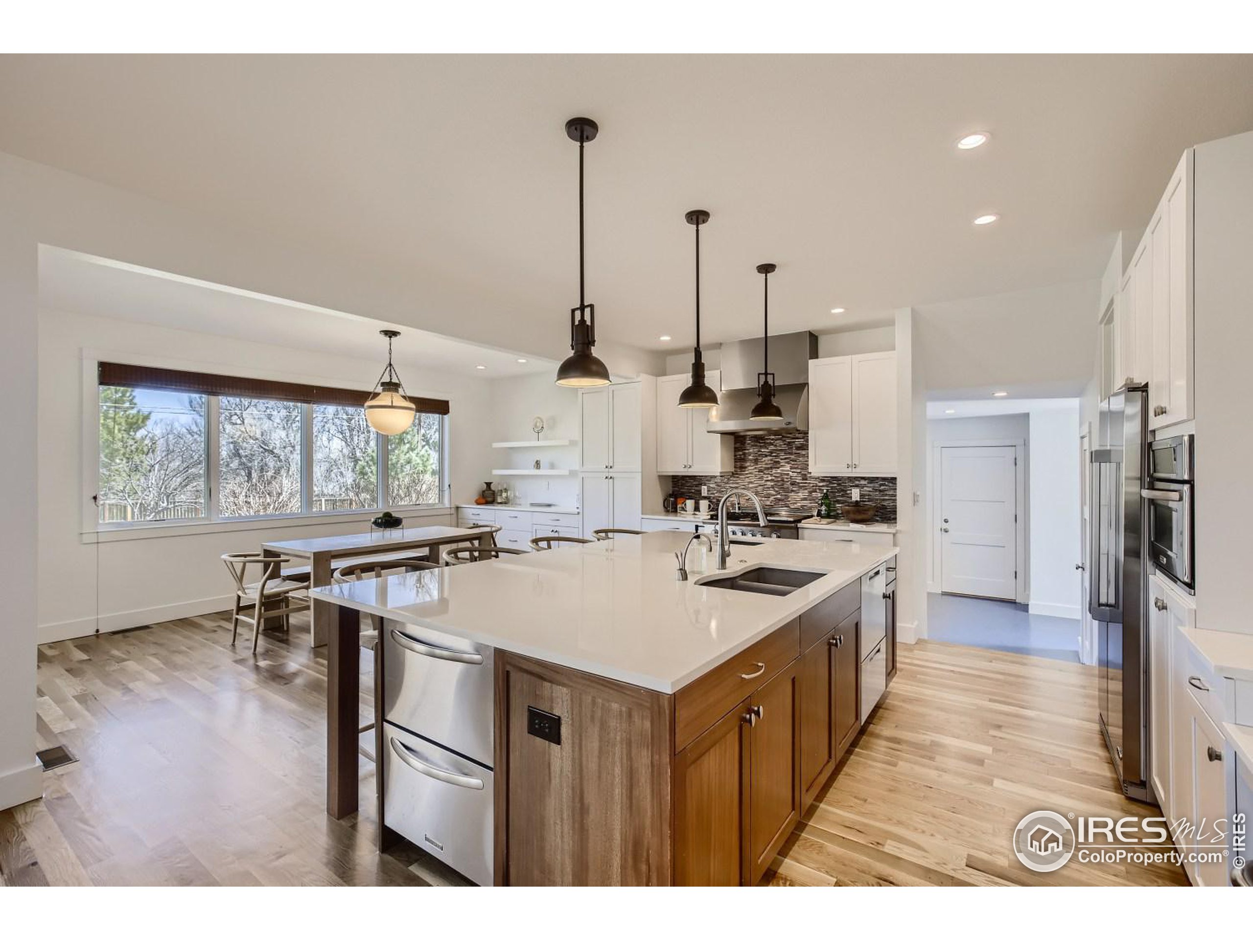 1525 Oak Avenue Boulder, CO 80304 - Photo 5 of 30 a kitchen with a stove a refrigerator a sink dishwasher with a dining table and chairs