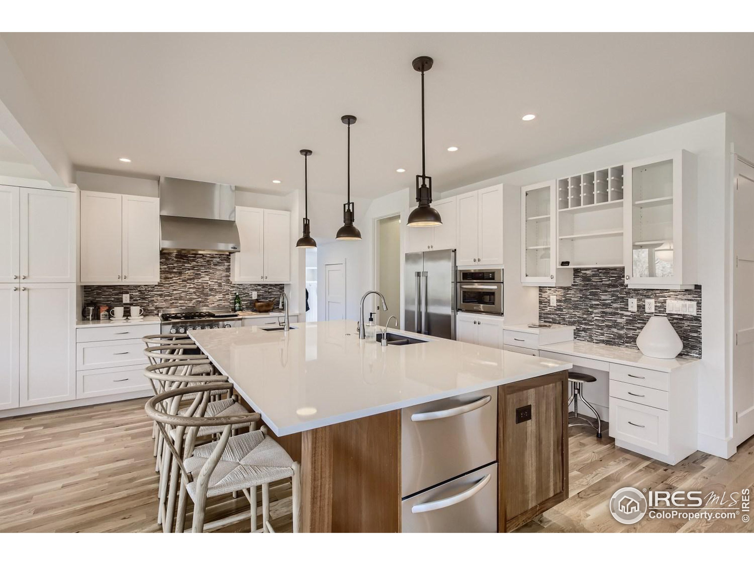 1525 Oak Avenue Boulder, CO 80304 - Photo 7 of 30 a kitchen with a table a stove a refrigerator and cabinets