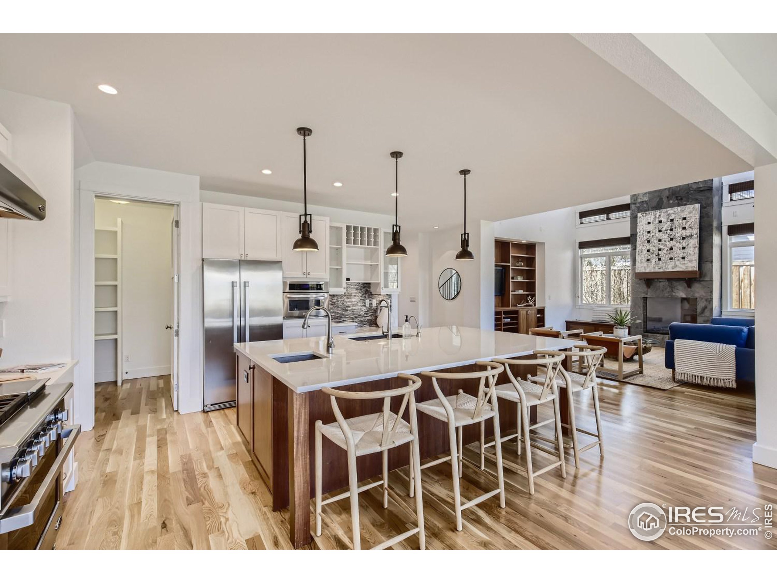1525 Oak Avenue Boulder, CO 80304 - Photo 10 of 30 a kitchen with stainless steel appliances a dining table chairs stove and cabinets