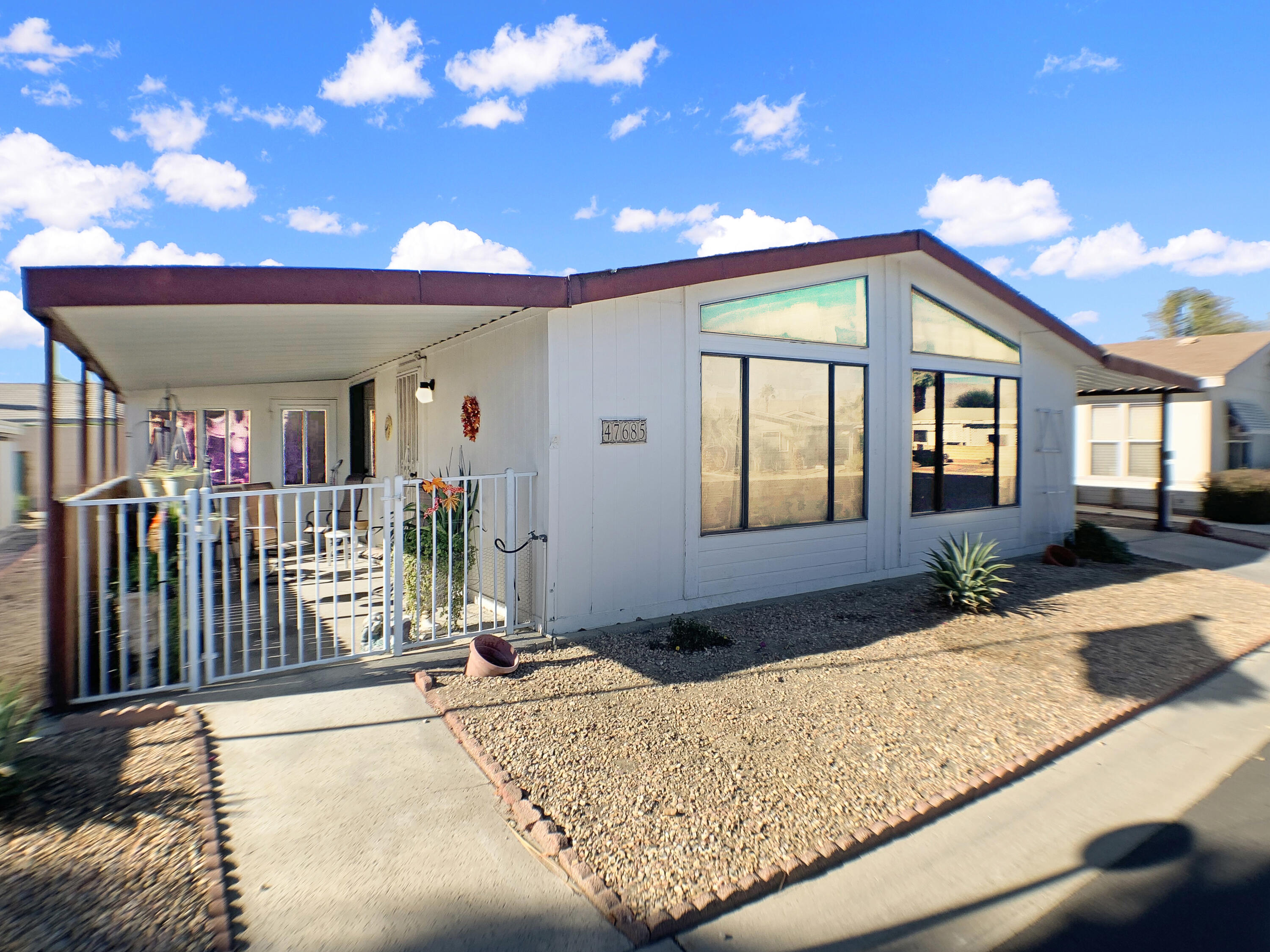 47685 Prado Way Indio, CA 92201 - Photo 3 of 26 a view of a house with a patio